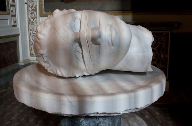 A striking marble sculpture by Polish artist Igor Mitoraj of the Head of St John the Baptist. The sculpture, made in 2006, is in the church of Santa Maria degli Angeli in Rome.